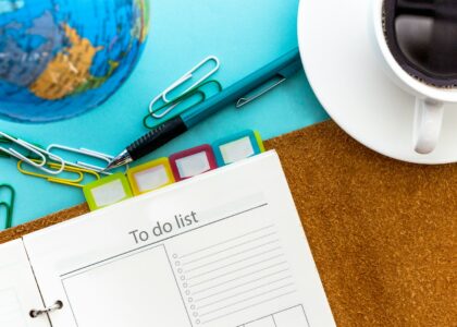 a calendar and scissors on a table