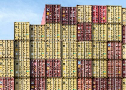 a large stack of shipping containers stacked on top of each other